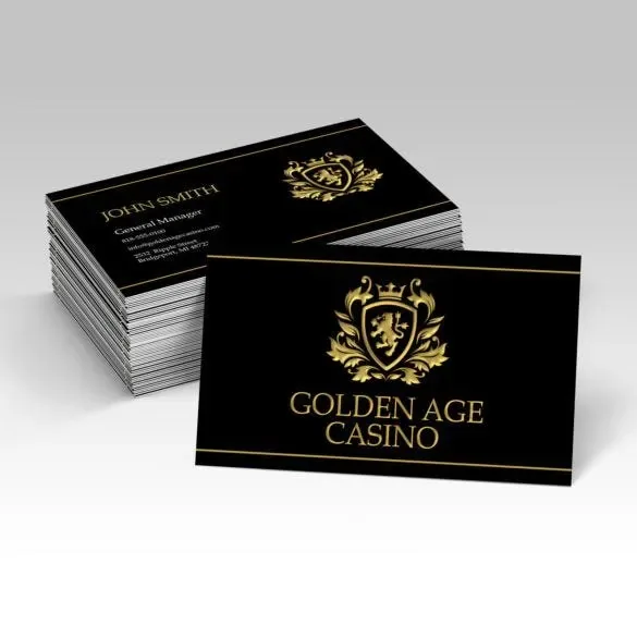 Black business cards with raised gold foil crest and lettering